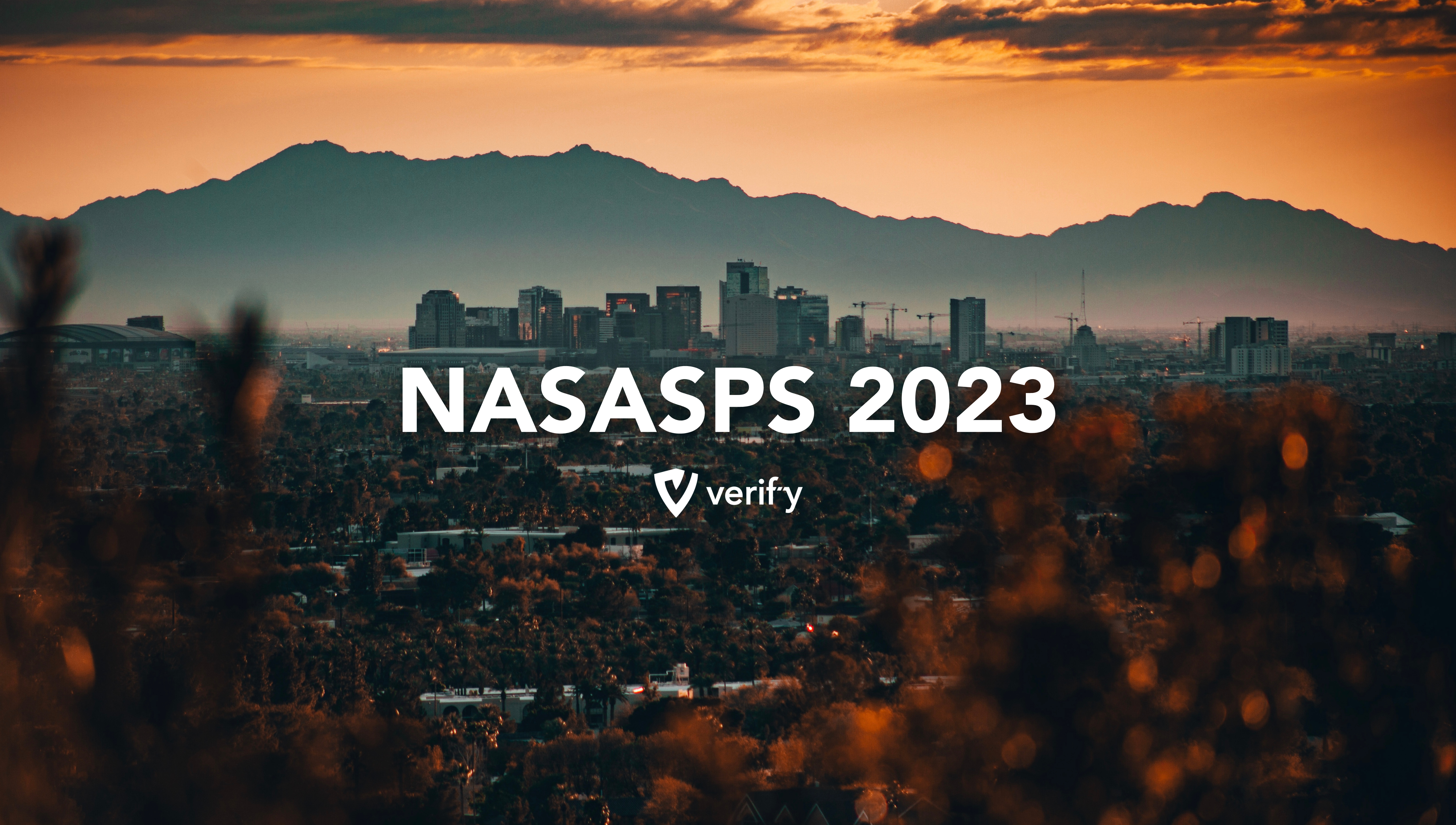 Photo of Phoenix, AZ at sunset with NASASPS 2023 written across and the Verif-y logo